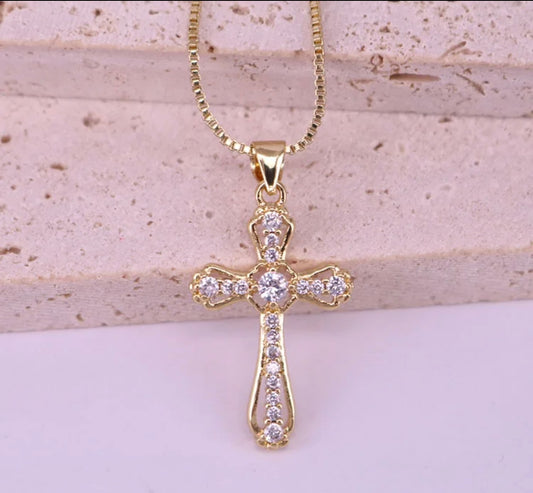 A Saint’s Touch Gold Cross Necklace